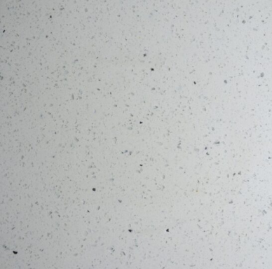 White surface with small black and grey specks throughout.