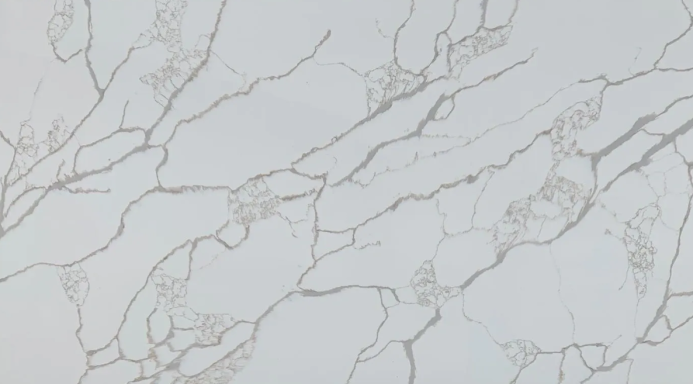 White marble surface with subtle grey veins and delicate patterns.