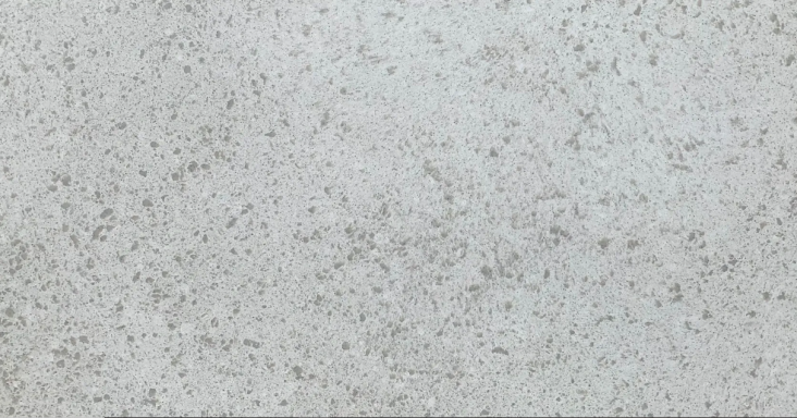 Light grey textured surface with subtle speckles and a uniform finish.