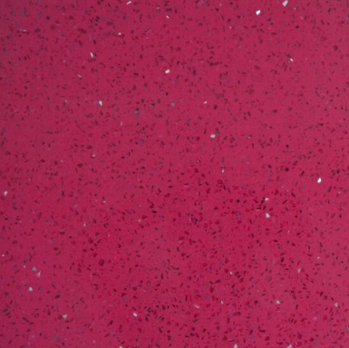 Textured fuchsia surface with speckles of white and black throughout.