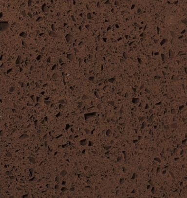 Brown textured surface with dark speckles.