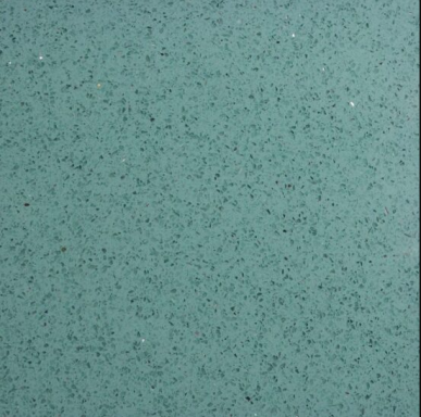 Textured surface in a teal colour with small black speckles.