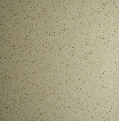 A textured beige surface with small, scattered speckles.